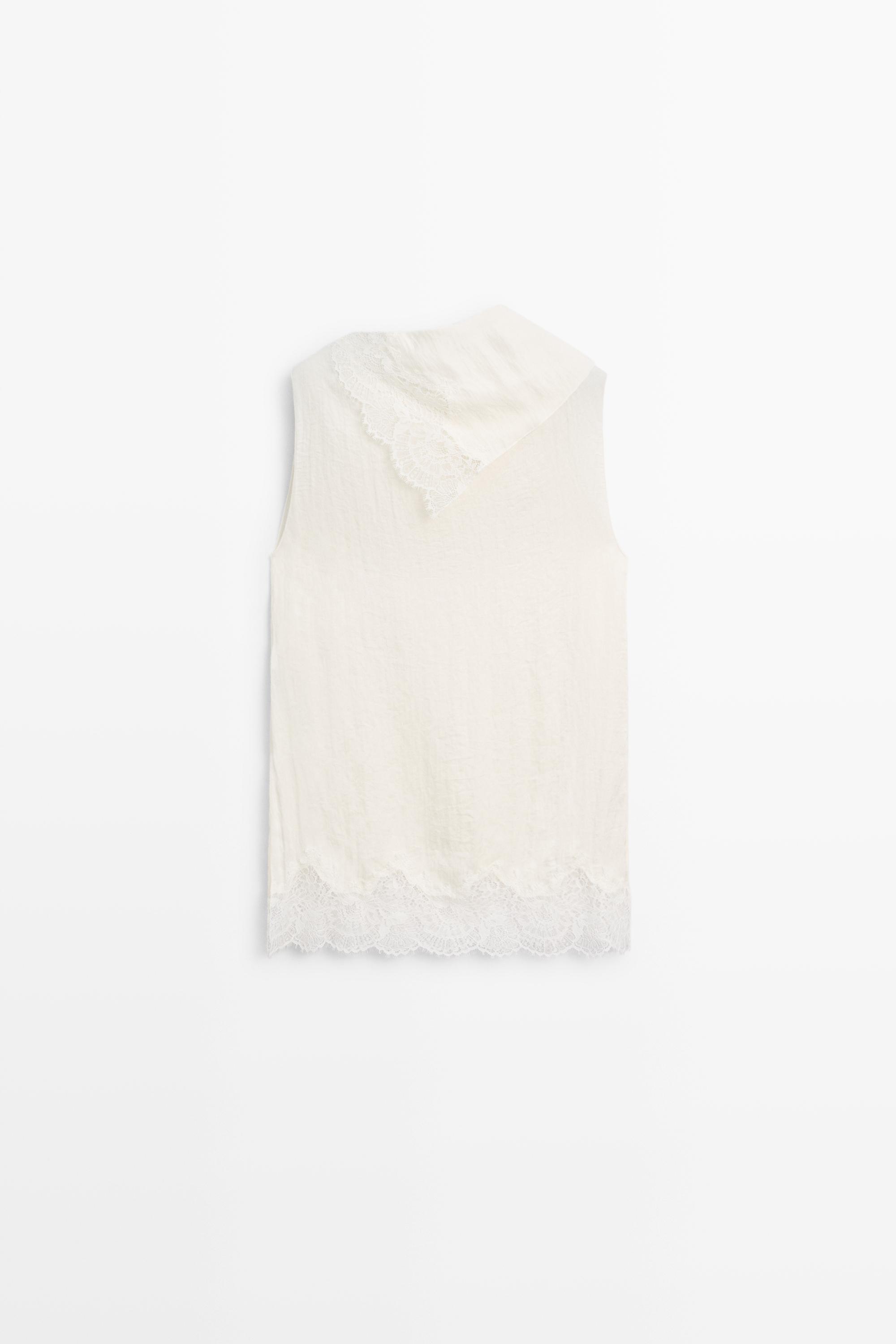 Asymmetric roll neck top with lace detail